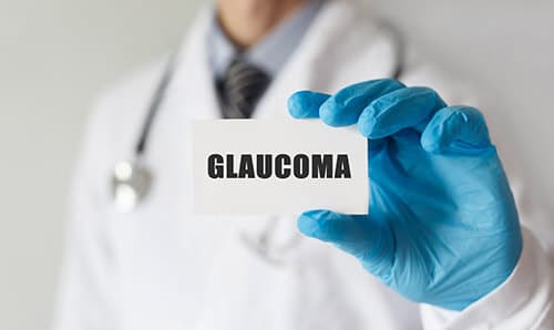 Doctor holding a card that says glaucoma