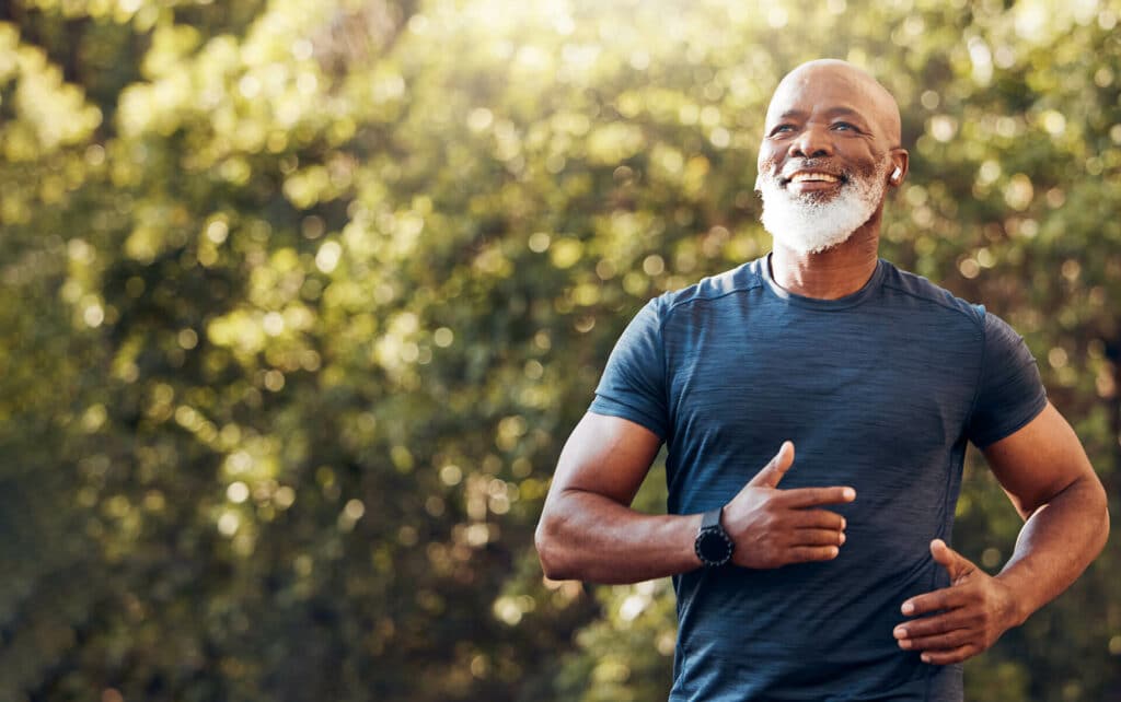 Fit man running outside